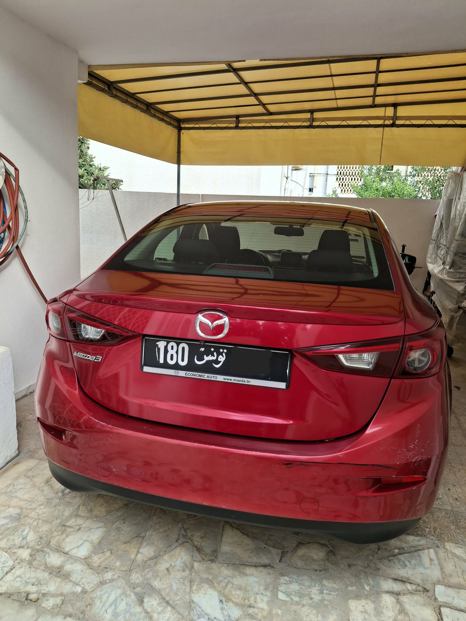 Bou Mhel El Bassatine&nbsp;Cite Plein Air&nbsp;Mazda&nbsp;3&nbsp;Mazda 3 berline rouge cristal